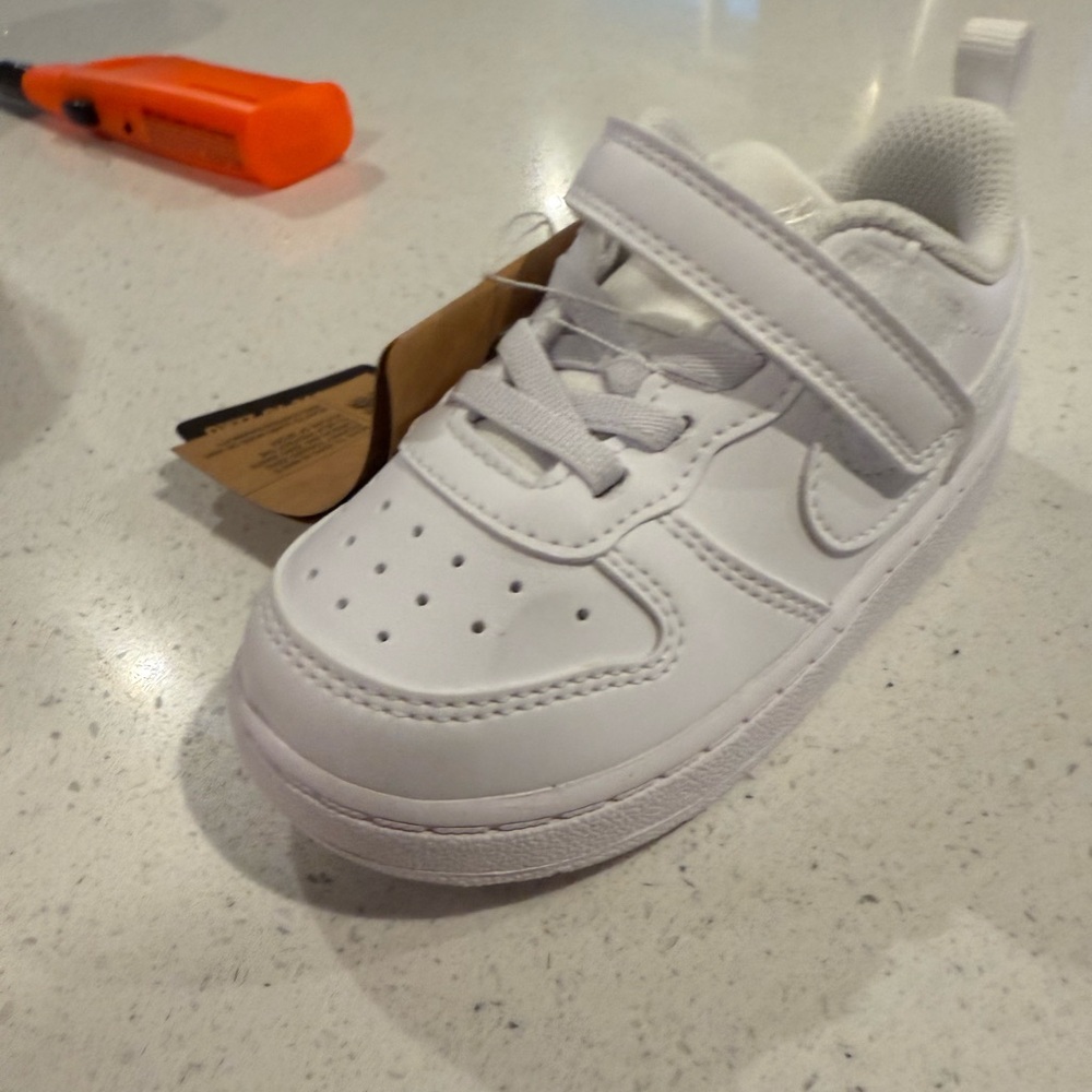 New, never work Nikes. Size 7C.